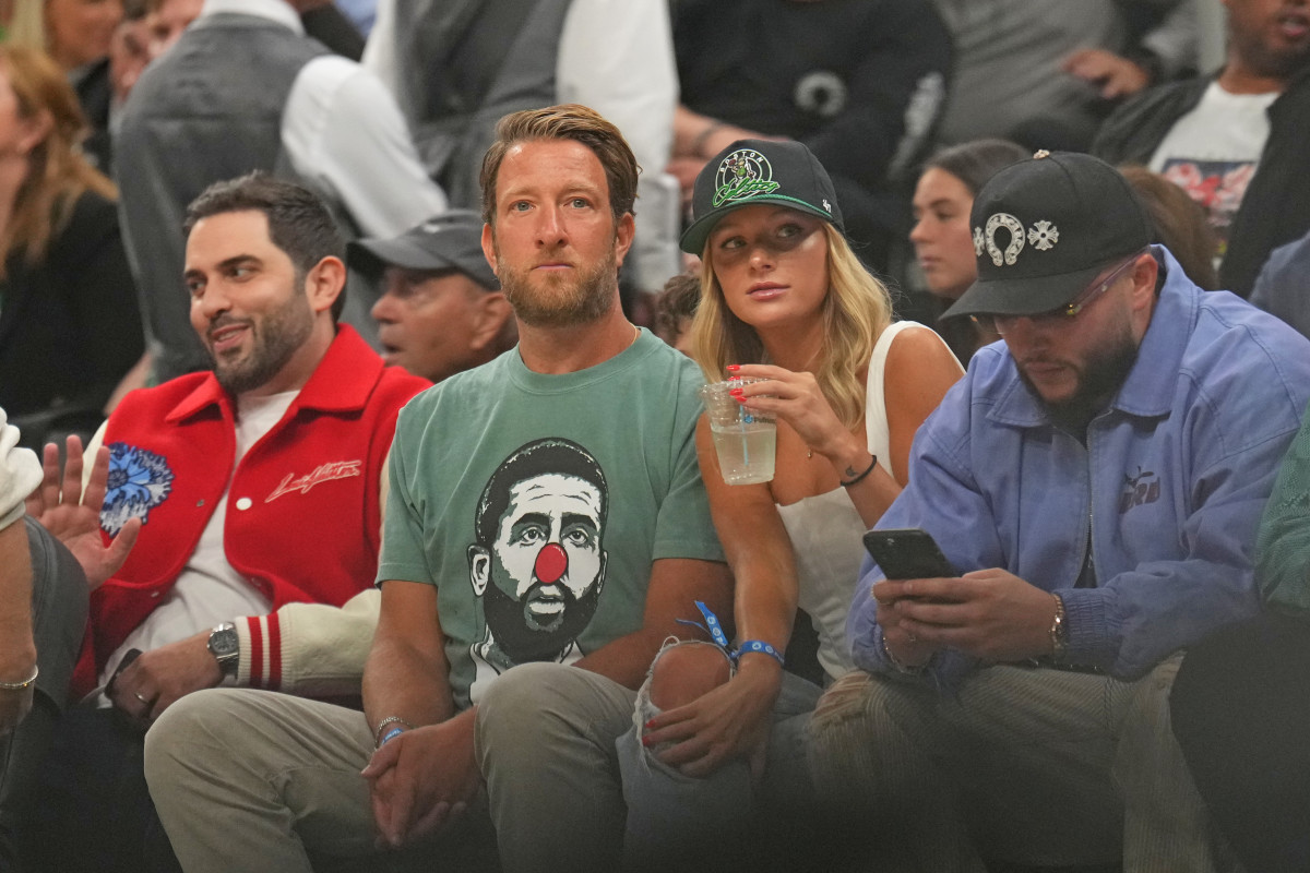 Portnoy and D'Aloia laughing courtside at TD Garden during the April 2024 Celtics–Heat game